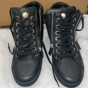 Chanel leather high top sneakers.